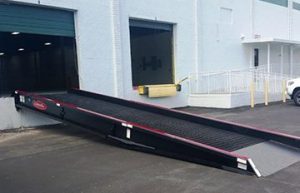 Copperloy's dock-to-ground-ramp set in place at a warehouse