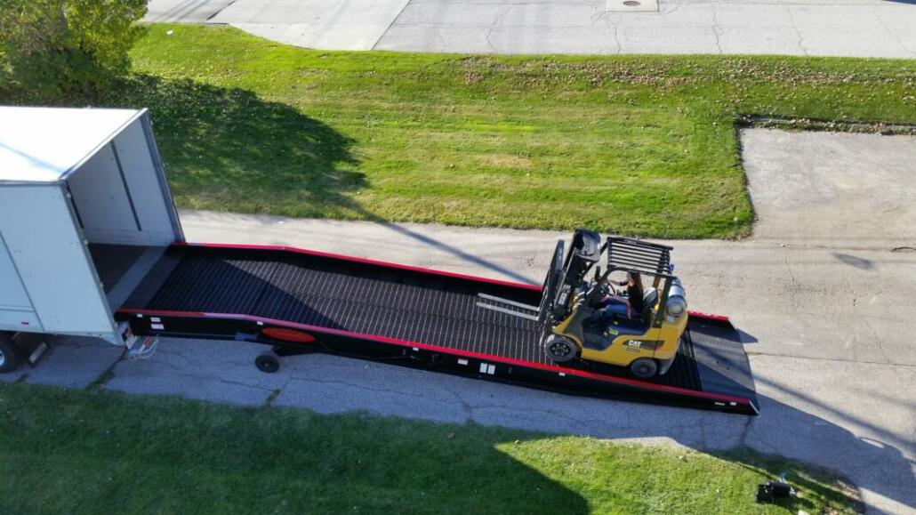 A forklift traveling up a Copperloy yard ramp