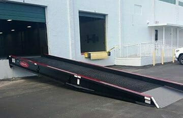 A dock ramp connected to a loading dock bay