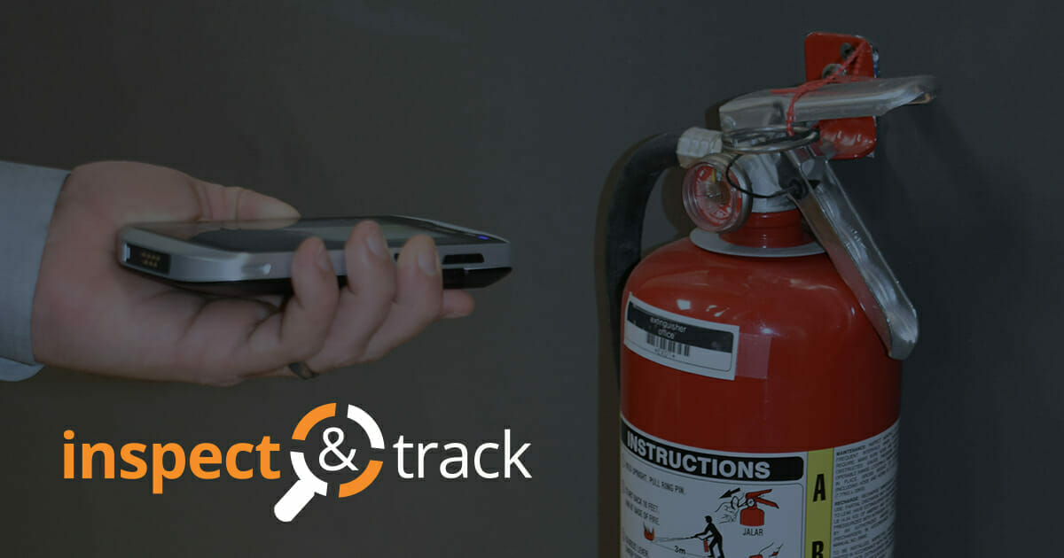 Someone using fire extinguisher inspection software to check the status of an extinguisher