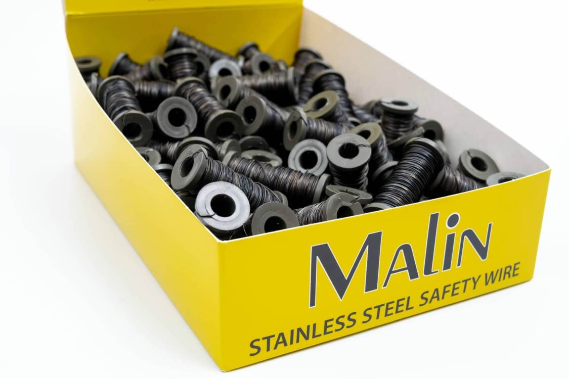 A yellow box of lock wire spools from Malin Co.
