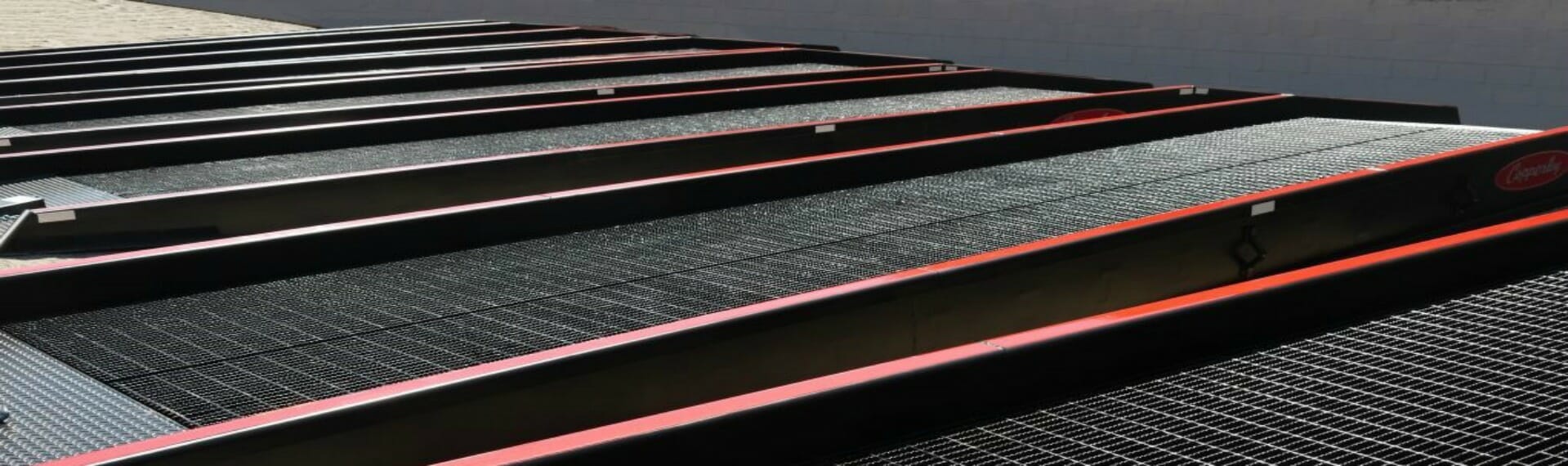 A series of Copperloy ramps. Rent a loading ramp from Copperloy.