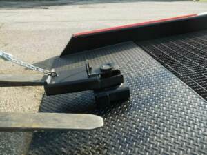 Copperloy yard ramp positioning sleeve with forklift fork slid inside.